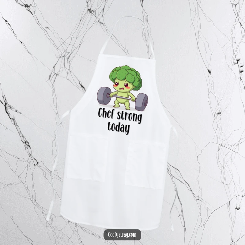 Funny apron featuring a determined broccoli floret lifting a heavy weight, perfect for cooks who love a healthy and humorous approach.