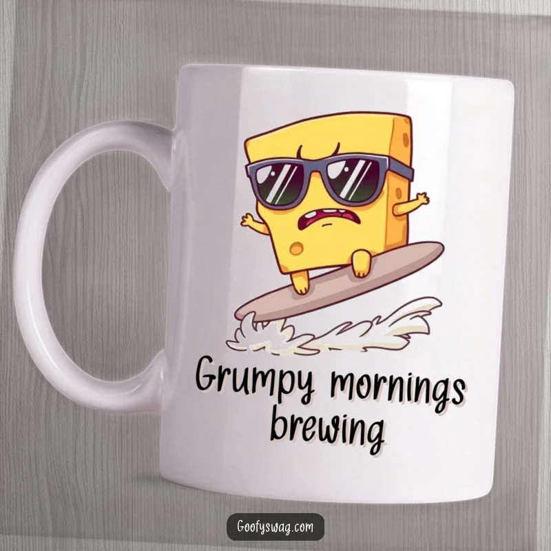Funny mug features a grumpy cheese slice in sunglasses attempting to surf a cracker, embodying cool defiance.