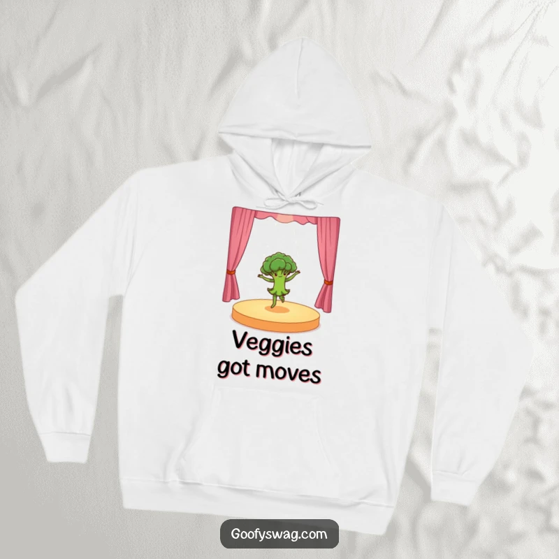 Funny dancing broccoli doing a dramatic pirouette on a tiny stage, a cozy hoodie design that combines warmth with energetic, humorous flair.
