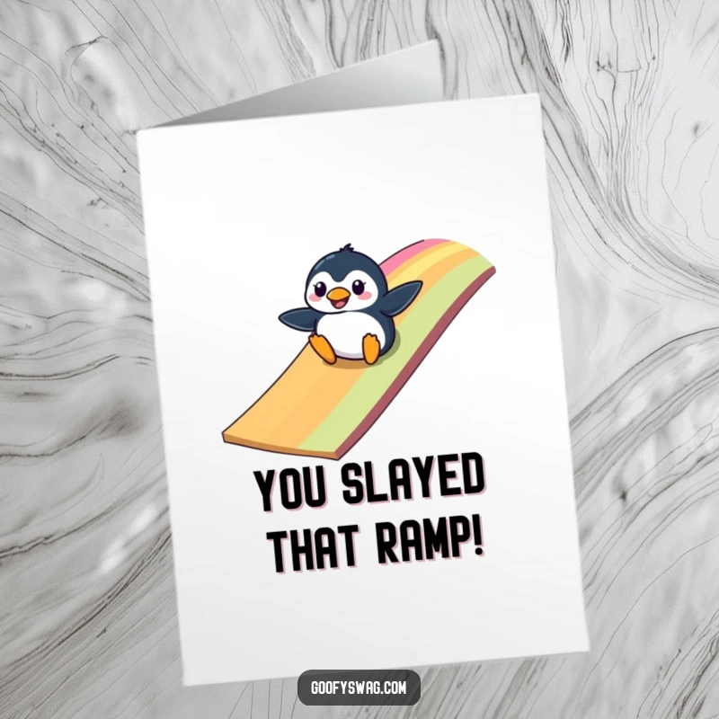 Funny Free Printable Congratulations Card: Clumsy penguin slides down a rainbow ramp, cartoon style, celebrating achievement, DIY download.